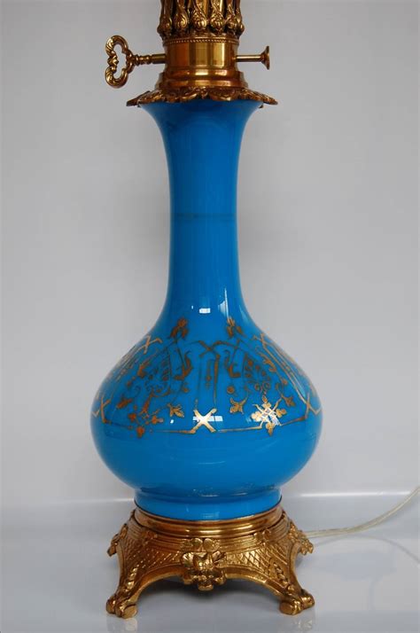 It accepts two standard View this item and discover similar for sale at 1stDibs - Striking blue opaline table lamp with gold trim. . Blue opaline lamp